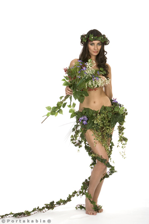 Woodland nymph. Naked woman descretely and strategically covered with leaves and ivy. Conceptual Photography by David Barr