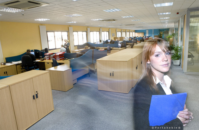 Girl walking through office on timed exposure. Conceptual Photography by David Barr
